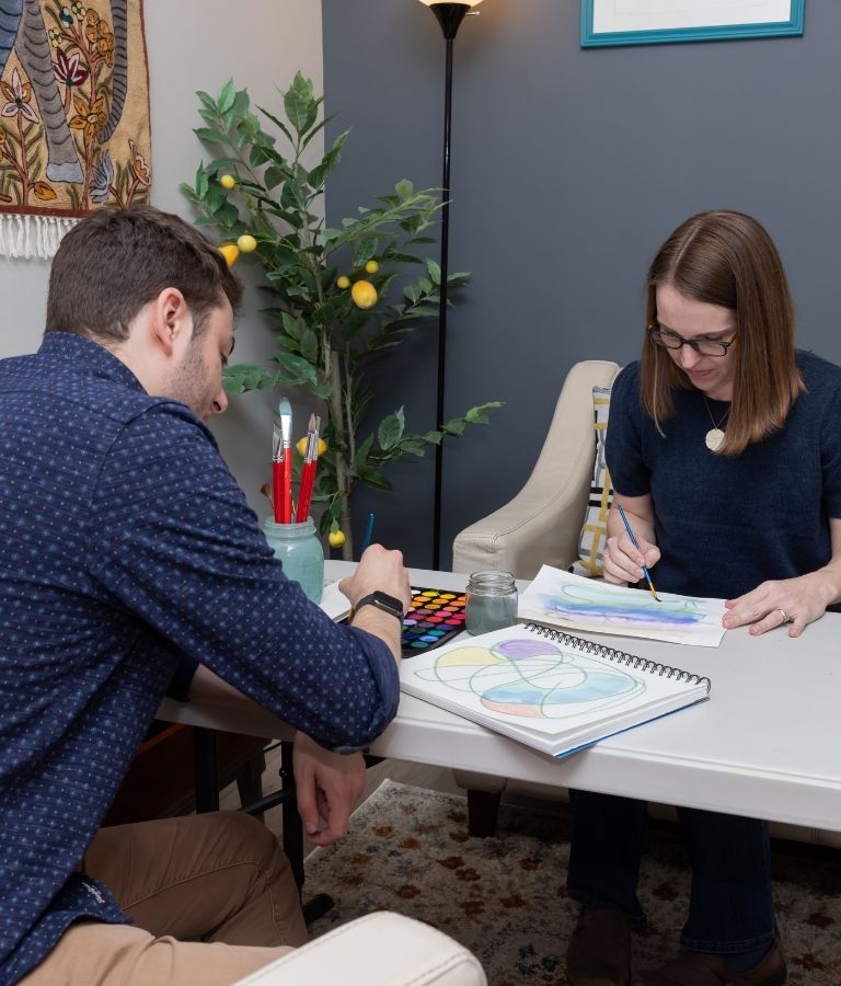 Teen creating artwork during an art therapy session at Cabush, Paul and Associates, Fairfax, VA