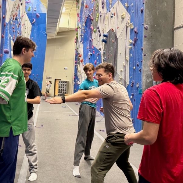 Jacod stein, a licensed therapist at Cabush, Paul & Associates in a rock climbing therapy session in Fairfax, VA