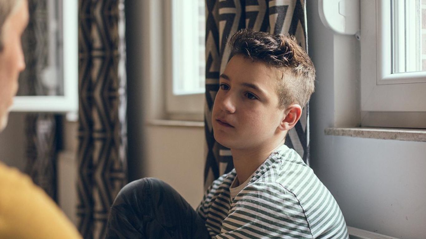 Teenage boy in Fairfax, VA discusses depression with parent